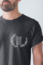 Person wearing a black t-shirt with 'Veni Vidi Bici' design on a plain background